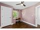 Bedroom showcasing a built-in desk with modern finishes, hardwood floors, and natural light at 1261 Calhoun Sw Ter, Atlanta, GA 30314