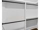 A closet with black rods for hanging clothes at 1261 Calhoun Sw Ter, Atlanta, GA 30314