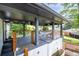 Relaxing covered porch with wood accents, metal railings, and charming decorative touches at 1261 Calhoun Sw Ter, Atlanta, GA 30314
