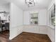 Bright dining room with large windows and elegant wainscoting at 1261 Calhoun Sw Ter, Atlanta, GA 30314