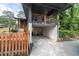 Exterior of a home featuring a carport and a fenced-in yard with lush landscaping at 1261 Calhoun Sw Ter, Atlanta, GA 30314