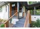 Charming front entrance with a contemporary railing and inviting covered entry way at 1261 Calhoun Sw Ter, Atlanta, GA 30314