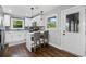 Modern kitchen with white cabinets, stainless steel appliances, and stylish bar seating at 1261 Calhoun Sw Ter, Atlanta, GA 30314