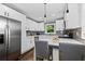 Charming kitchen with white cabinets, quartz countertops and stainless steel appliances at 1261 Calhoun Sw Ter, Atlanta, GA 30314