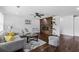 Cozy living room featuring hardwood floors, a decorative fireplace, and modern furniture at 1261 Calhoun Sw Ter, Atlanta, GA 30314