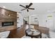 Cozy living room featuring a fireplace, ceiling fan, and stylish decor at 1261 Calhoun Sw Ter, Atlanta, GA 30314