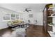 Bright living room featuring hardwood floors, modern decor, and large windows at 1261 Calhoun Sw Ter, Atlanta, GA 30314