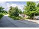 The walking path shows a bench for resting and mature trees at 1261 Calhoun Sw Ter, Atlanta, GA 30314