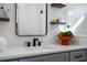 Close-up of a bathroom vanity with a white countertop and a modern matte black faucet at 2328 Mason Drive Dr, Atlanta, GA 30316