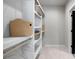 Bright walk-in closet featuring custom shelving and ample storage space for organization at 2328 Mason Drive Dr, Atlanta, GA 30316