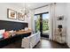 Dining area with modern decor, natural light, bench seating, and a stylish bar cart at 2328 Mason Drive Dr, Atlanta, GA 30316