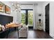Dining area featuring a modern light fixture, custom bench seating, and natural light from the patio doors at 2328 Mason Drive Dr, Atlanta, GA 30316