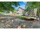 The home's large backyard features a trampoline and provides ample space for recreational activities at 127 Muirwood Dr, Temple, GA 30179