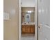 Bathroom featuring a wooden single sink vanity viewed through a doorway at 127 Muirwood Dr, Temple, GA 30179