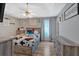 Comfortable bedroom with a cozy bed, wood-look flooring, and natural light at 127 Muirwood Dr, Temple, GA 30179