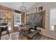 The charming dining area has natural light, a blackboard accent, and a unique picnic-style table at 127 Muirwood Dr, Temple, GA 30179
