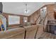 Inviting living room with a fireplace, staircase, and comfortable seating; lots of natural light at 127 Muirwood Dr, Temple, GA 30179