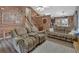 Relaxing living room featuring wood-look accents, comfortable seating and an inviting area at 127 Muirwood Dr, Temple, GA 30179