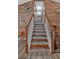 Staircase with wood and white accents; decorative wood walls lead to the upper level at 127 Muirwood Dr, Temple, GA 30179