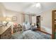 Bright bedroom featuring playful decor, a cozy chair, and natural light at 177 Coopers Pond Dr, Lawrenceville, GA 30044