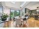 Open-concept kitchen with updated appliances, custom cabinetry, and a sunny breakfast nook at 177 Coopers Pond Dr, Lawrenceville, GA 30044