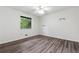 Bedroom with wood-look floors, offering a view of the trees outside the window at 1832 Tree Top Ct, Marietta, GA 30062