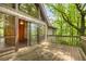 Wooden deck with sliding glass doors offering access to the home's interior at 1832 Tree Top Ct, Marietta, GA 30062