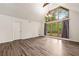 Bright living room with hardwood floors, white walls, and a large window offering great views at 1832 Tree Top Ct, Marietta, GA 30062