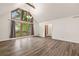 Bright living room with hardwood floors, white walls, and a large window at 1832 Tree Top Ct, Marietta, GA 30062