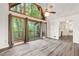 Open concept living room with hardwood floors that flows into the bright kitchen at 1832 Tree Top Ct, Marietta, GA 30062