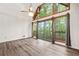 Living room with hardwood floors, light walls and a sliding glass door leading to the outdoor deck at 1832 Tree Top Ct, Marietta, GA 30062