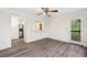 Open living area with new wood-look flooring, ceiling fan, and access to the outdoors at 1832 Tree Top Ct, Marietta, GA 30062