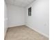 Room featuring neutral walls and linoleum flooring with a window on one of the walls at 1832 Tree Top Ct, Marietta, GA 30062