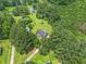 Aerial shot of a home nestled among mature trees, showcasing its private setting at 28 Fawn Ct, Sharpsburg, GA 30277