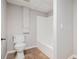 Bathroom with a toilet, shower/tub, and neutral walls, offering a functional and updated space at 28 Fawn Ct, Sharpsburg, GA 30277