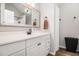 Bright bathroom with a white vanity, framed mirror, and modern fixtures for a clean, updated look at 28 Fawn Ct, Sharpsburg, GA 30277