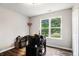 Bedroom featuring hardwood floors, a large window, and neutral walls at 28 Fawn Ct, Sharpsburg, GA 30277