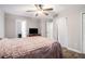 Bright bedroom with ceiling fan, neutral walls, and hardwood-style flooring at 28 Fawn Ct, Sharpsburg, GA 30277