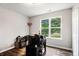 Bedroom with a large window, providing natural light and street views, offering a cozy living space at 28 Fawn Ct, Sharpsburg, GA 30277