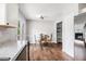 Dining area featuring wood floors, stainless steel refrigerator and access to the backyard at 28 Fawn Ct, Sharpsburg, GA 30277