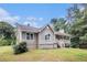 View of the exterior of the home, highlighting its charming architectural details at 28 Fawn Ct, Sharpsburg, GA 30277
