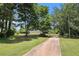 Street view showcasing the home's curb appeal and surrounding greenery at 28 Fawn Ct, Sharpsburg, GA 30277