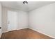 Room featuring carpet flooring, neutral walls, and a white door, offering a clean and simple space at 28 Fawn Ct, Sharpsburg, GA 30277