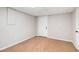 Room with neutral walls, carpet flooring, and a white door, offering a versatile and customizable space at 28 Fawn Ct, Sharpsburg, GA 30277