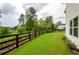 Spacious backyard with lush green lawn and fencing at 4380 Serenity Lake Dr, Cumming, GA 30028