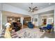 Spacious living area showcasing open floor plan to kitchen with modern furnishings at 4380 Serenity Lake Dr, Cumming, GA 30028