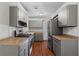 Contemporary kitchen featuring stainless steel appliances, updated cabinetry and stylish countertops at 4090 Tara Dr, Forest Park, GA 30297