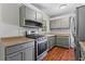 Updated kitchen featuring modern appliances, ample counter space, and well-lit cabinetry at 4090 Tara Dr, Forest Park, GA 30297