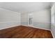 Hardwood floors and large window accentuates this light and airy living room at 4090 Tara Dr, Forest Park, GA 30297
