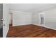 Living room featuring hardwood floors and neutral wall colors, with a view of an adjacent room at 4090 Tara Dr, Forest Park, GA 30297